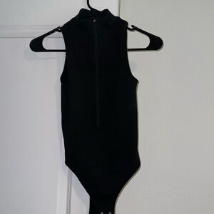 New with tags! Garage brand, black zipper body suit size XS never worn